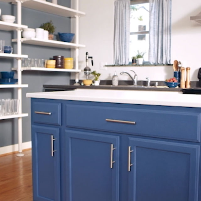 Cool blue kitchen color scheme with blue kitchen cabinets.