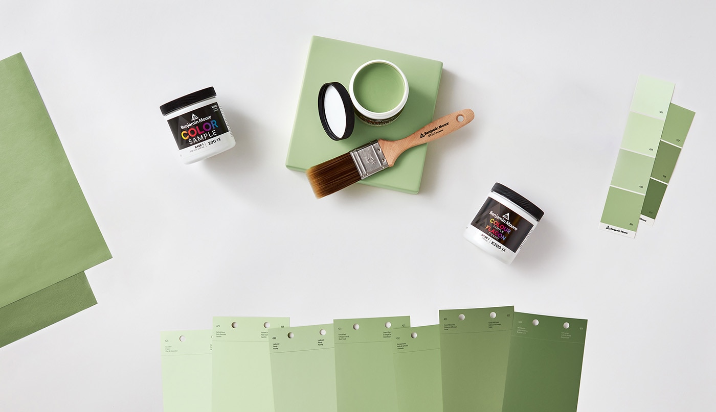 An open can of paint color sample and an array of color swatches.