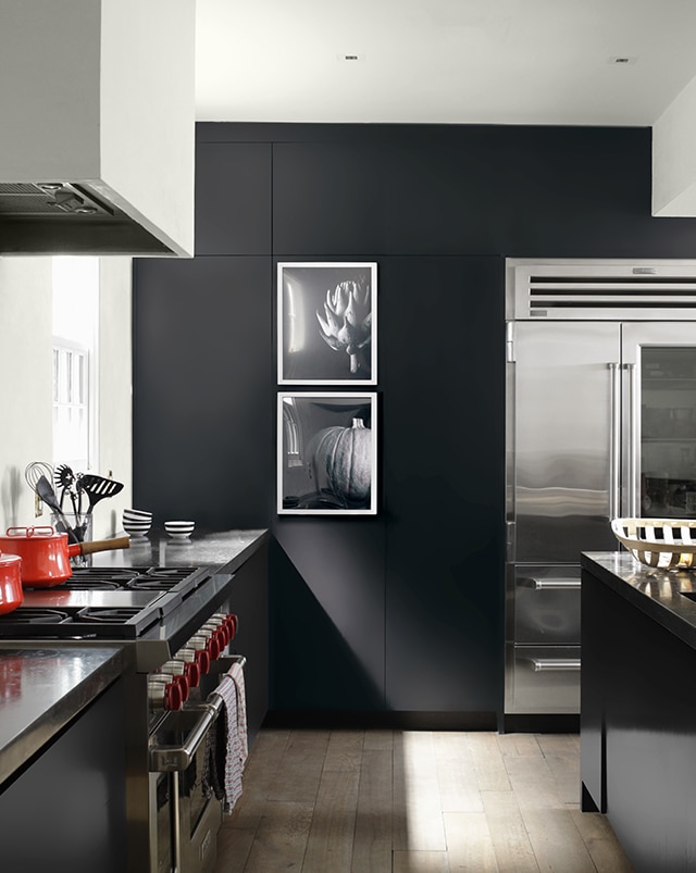 A slick, black kitchen accent wall painted in Black Tar 2126-10