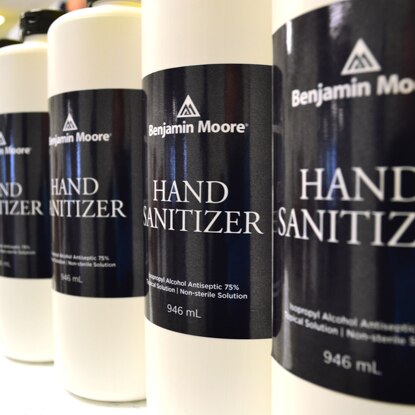 A line of bottled Benjamin Moore hand sanitizer. A line of bottled Benjamin Moore hand sanitizer.