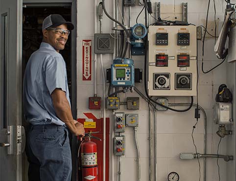 A Benjamin Moore employee at manufacturing facility. A Benjamin Moore employee at manufacturing facility.