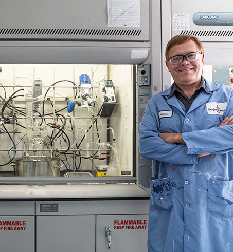 A Benjamin Moore scientist stands next to a lab hood in the R&D lab. A Benjamin Moore scientist stands next to a lab hood in the R&D lab.