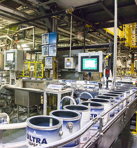 Cans of Benjamin Moore Ultra Spec 500 ride along the filling line. Cans of Benjamin Moore Ultra Spec 500 ride along the filling line.