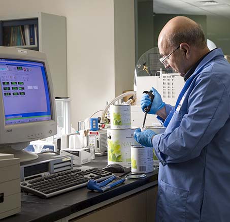 A Benjamin Moore chemist measures samples of Natura paint. A Benjamin Moore chemist measures samples of Natura paint.