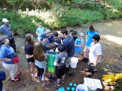A group of young volunteers discuss their good deeds. A group of young volunteers discuss their good deeds.