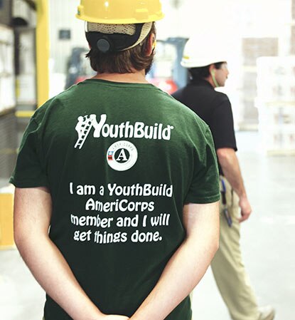 A YouthBuild student visits a Benjamin Moore facility. A YouthBuild student visits a Benjamin Moore facility.