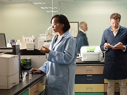 Several Benjamin Moore lab techs work in the lab.
