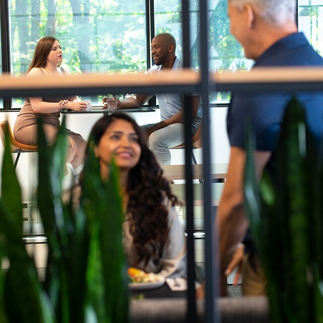 Several Benjamin Moore employees enjoy lunch in the Montvale café.