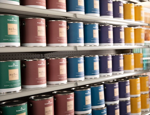 Shelves in a Benjamin Moore store lined with Regal Select.