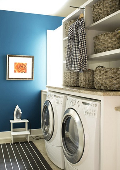 A bright blue laundry room accent wall painted with Blue Danube 2062-30.