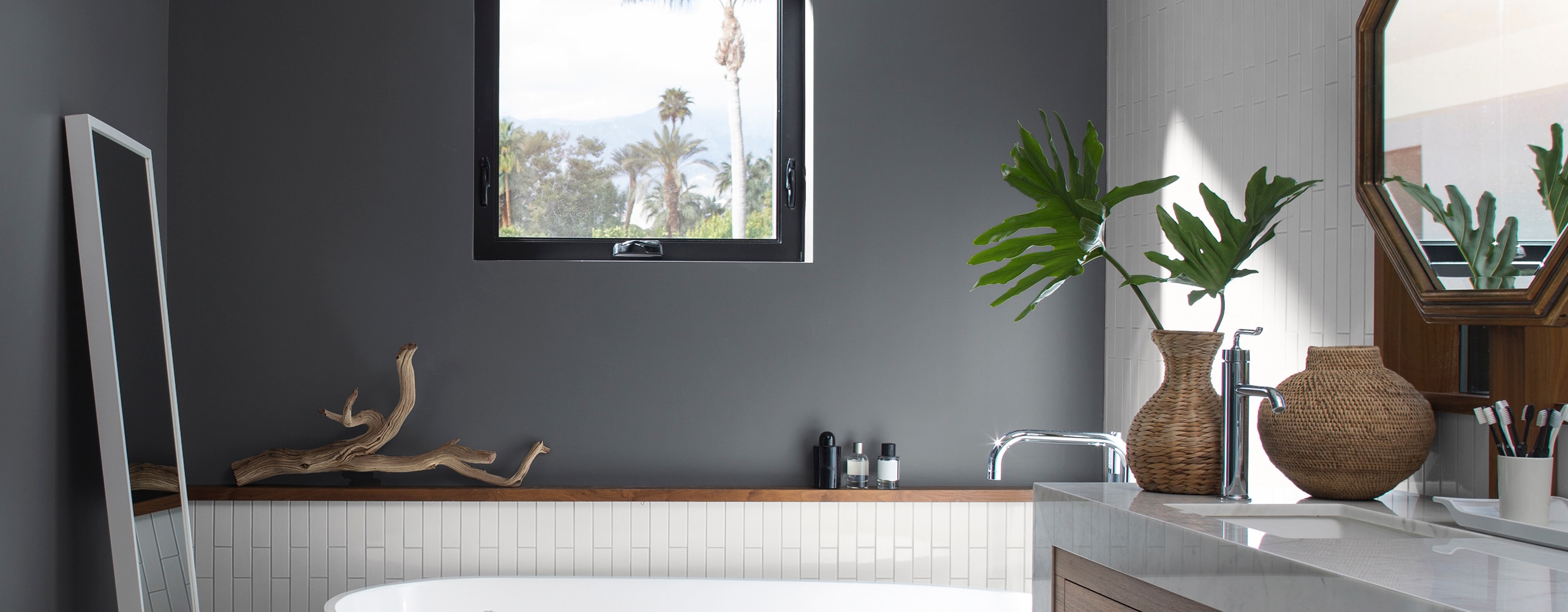 Bathroom walls painted in a matte gray charcoal slate paint colour.