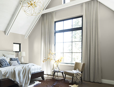 Neutral bedroom painted in Wish AF-680 with white cathedral ceiling in Baby's Breath OC-62.