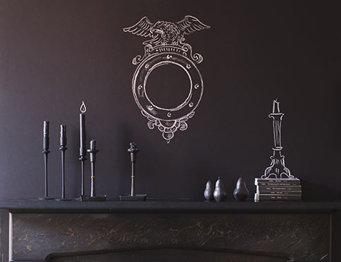 Chalkboard paint lends an artistic flare to the space above a gothic mantel. Chalkboard paint lends an artistic flare to the space above a gothic mantel.