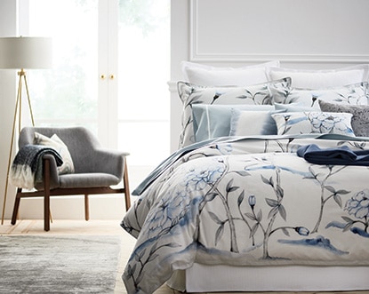 A serene bedroom features Benjamin Moore paint and Gluckstein Home bedding. A serene bedroom features Benjamin Moore paint and Gluckstein Home bedding.