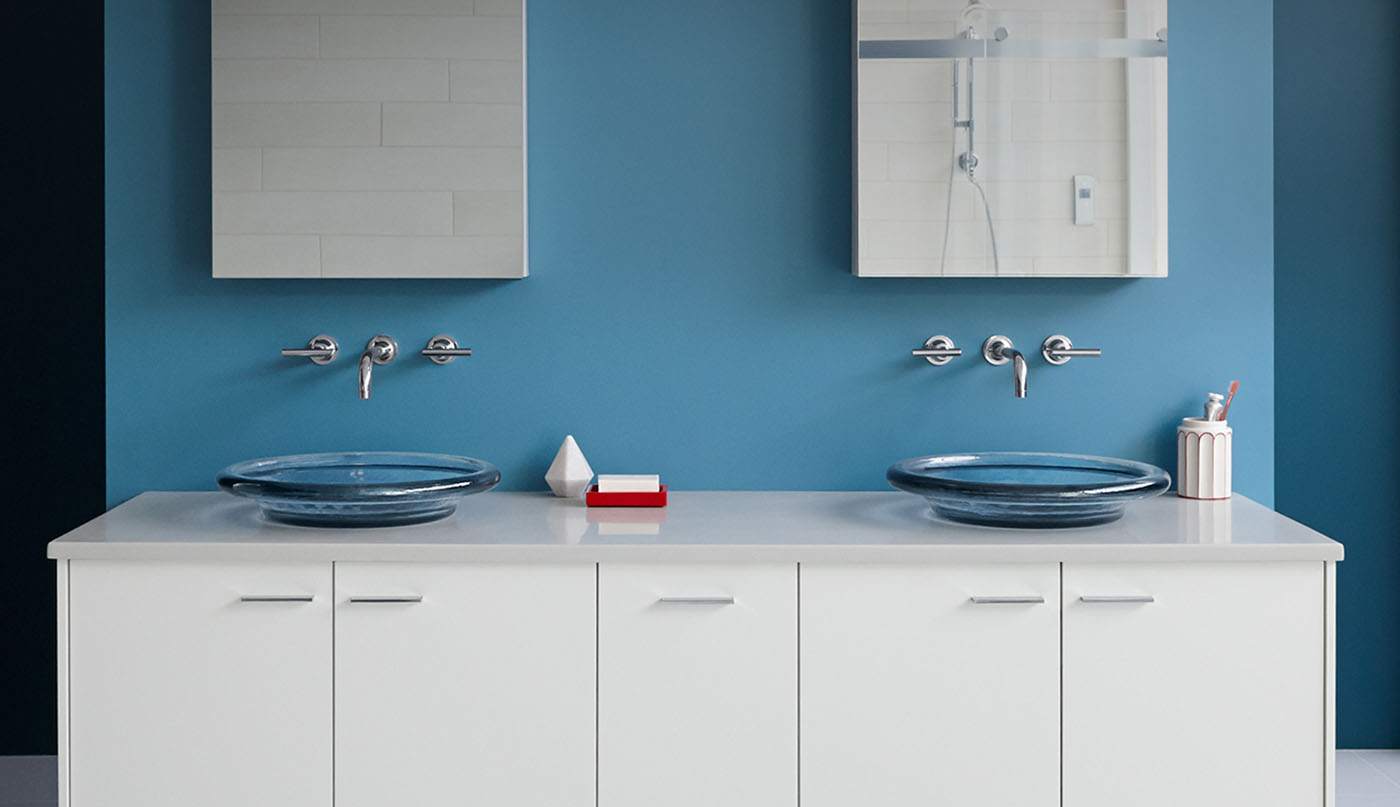 Blue master bathroom with Kohler finishes and large bathtub