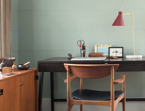 Home office walls painted in a silver blue paint color.