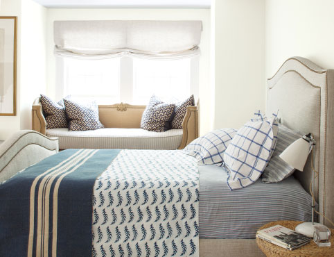 Bedroom with nautical-inspired blue striped rug and walls painted in Icicle OC-60. Bedroom with nautical-inspired blue striped rug and walls painted in Icicle OC-60.