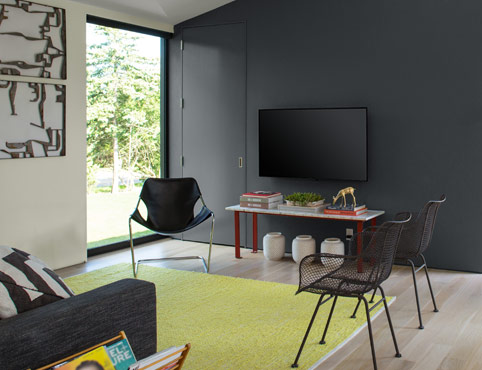 Gray painted accent wall with white walls in living room.