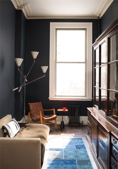 Deep blue painted walls in living room