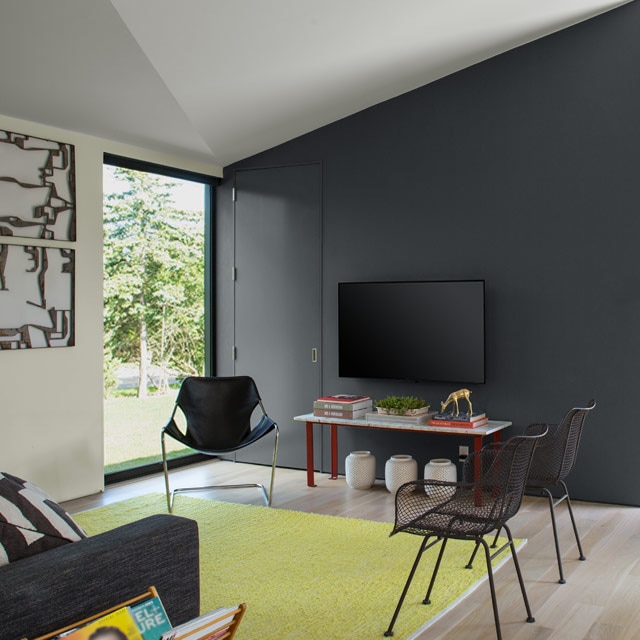 Contemporary living room with dark gray feature wall.