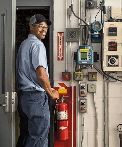 A Benjamin Moore employee at a manufacturing facility.