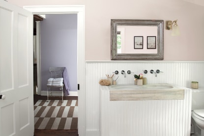Neutral bathroom walls painted in Antique Pearl 2113-70 pair with a violet hallway painted in Lavender Mist 2070-60 to create an analogous color scheme.