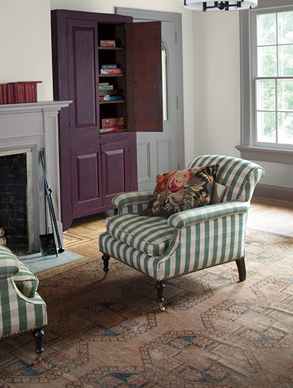 Two distinct gray paint colors yield different undertones in a traditional family room.