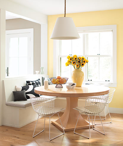 A sunny kitchen corner painted in Hawthorne Yellow HC-4.