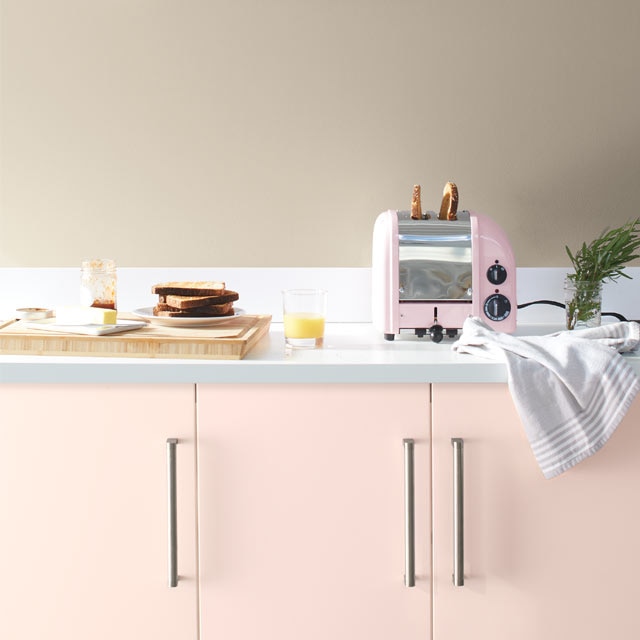 A pale kitchen with pink cabinets painted with Benjamin Moore's 2020 Colour of the Year