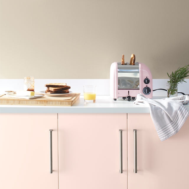 A pale kitchen with pink cabinets painted with Benjamin Moore's 2020 Color of the Year