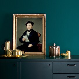 A wall painted in Beau Green 2054-20 accented with a cabinet painted in Hale Navy HC-154. A wall painted in Beau Green 2054-20 accented with a cabinet painted in Hale Navy HC-154.