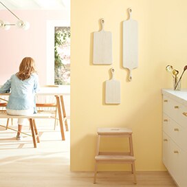A light kitchen with pale yellow walls and white-painted cabinets. A light kitchen with pale yellow walls and white-painted cabinets.
