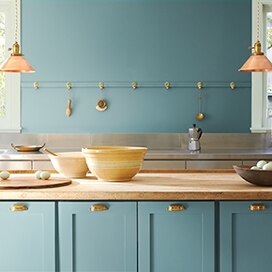 A kitchen with walls and cabinets painted with the Colour of the Year 2021, Aegean Teal 2136-40. A kitchen with walls and cabinets painted with the Colour of the Year 2021, Aegean Teal 2136-40.