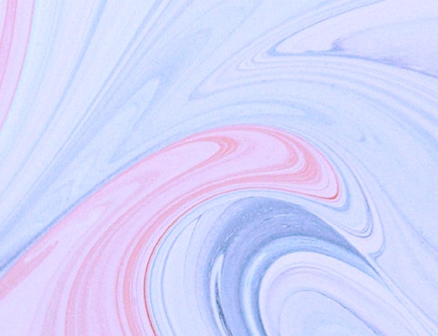 An example of unmatchable Benjamin Moore paint color being mixed seen in swirling shades of blue, pink and white, a reflection of the precise combination of Benjamin Moore paint and proprietary Gennex® colorant.