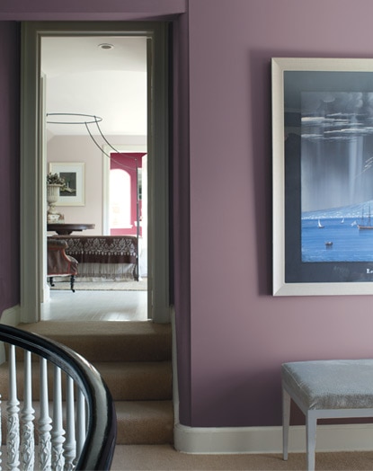 A peek through several doorways on the upper level of a residential home show the monochromatic harmony of berry and blush tones. A peek through several doorways on the upper level of a residential home show the monochromatic harmony of berry and blush tones.