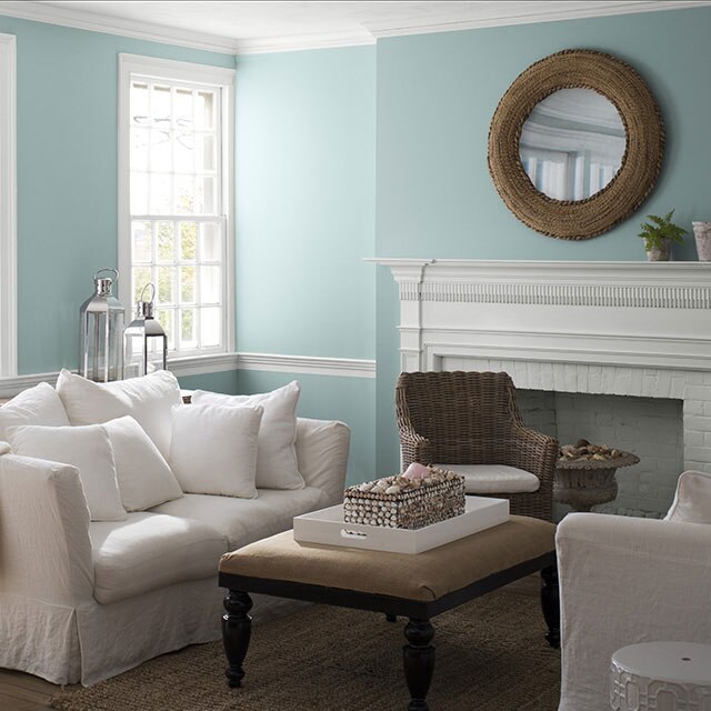 A living room painted in Gossamer Blue 2123-40 to show the impact of cool paint colors.