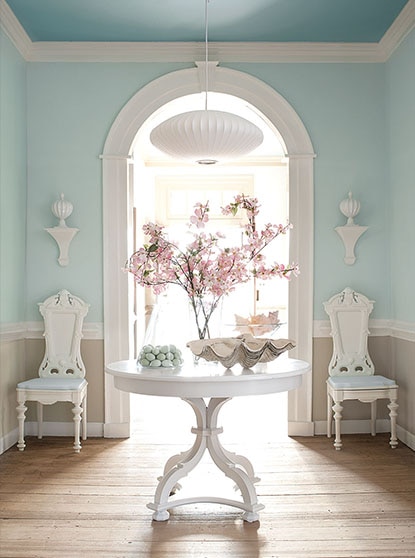 Front hall with pastel accents and center table Front hall with pastel accents and center table