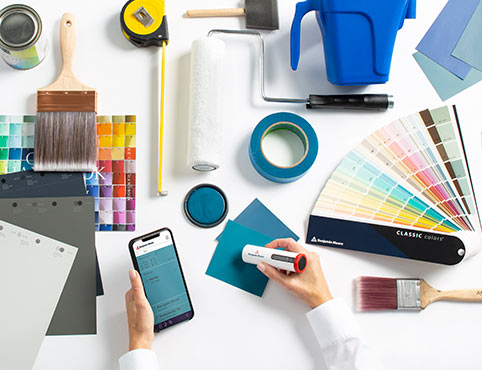 ColorReader Pro device and Color Portfolio app in use at a busy professional's desk.