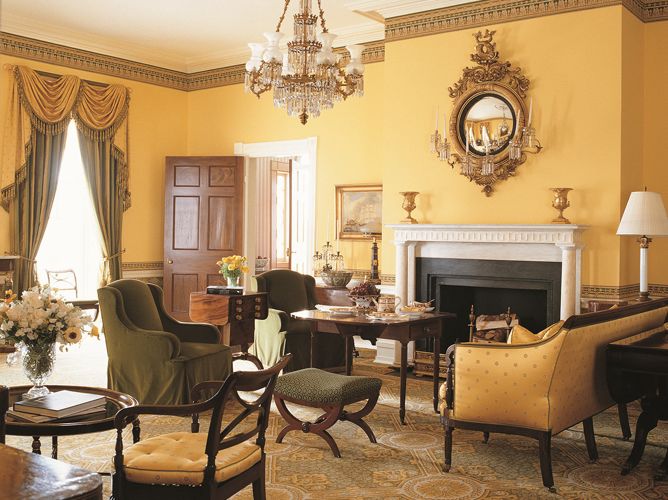 A lovely yellow parlour in Gracie Manor, the mayorial residence of NYC, offers an exuberant take on traditional design.