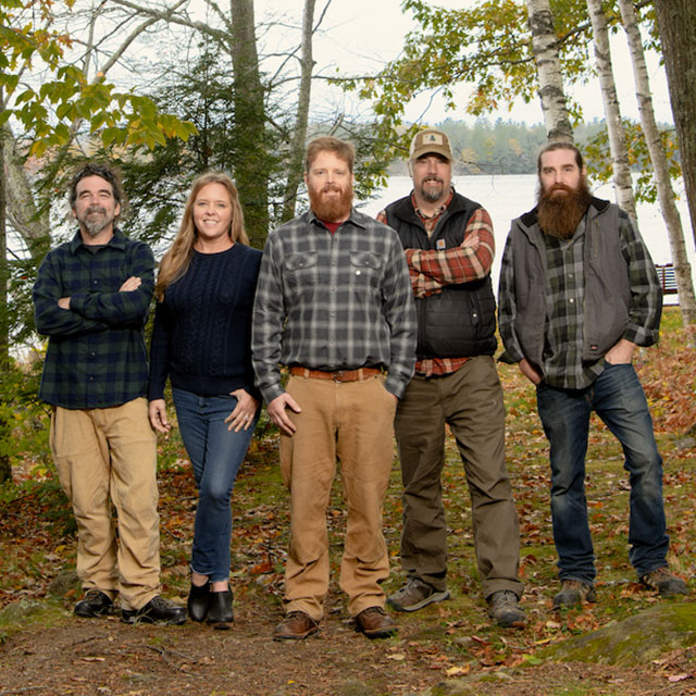 The 5-person cast of Maine Cabin Masters, who also own the Kennebec Cabin Company, pose in the woods. The 5-person cast of Maine Cabin Masters, who also own the Kennebec Cabin Company, pose in the woods.