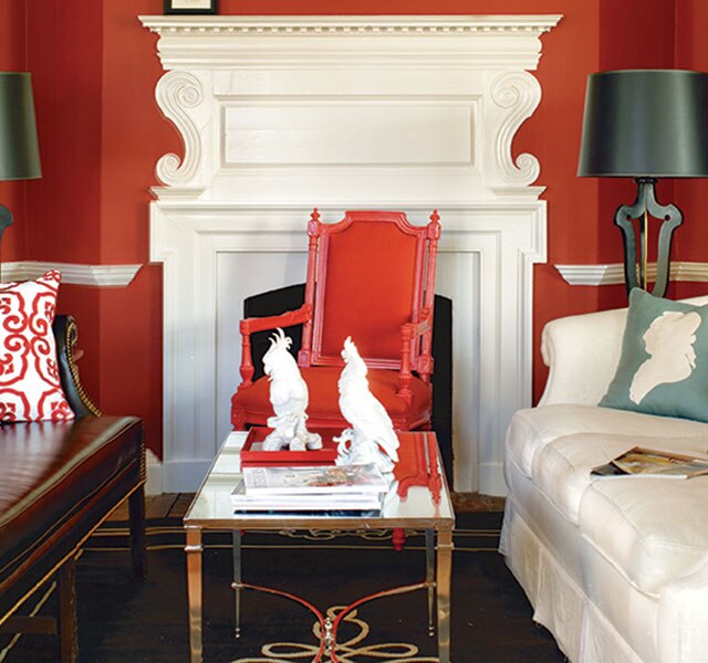 Red living room with bold patterns and mixed styles