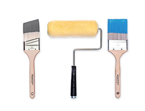 Two paint brushes and a paint roller.