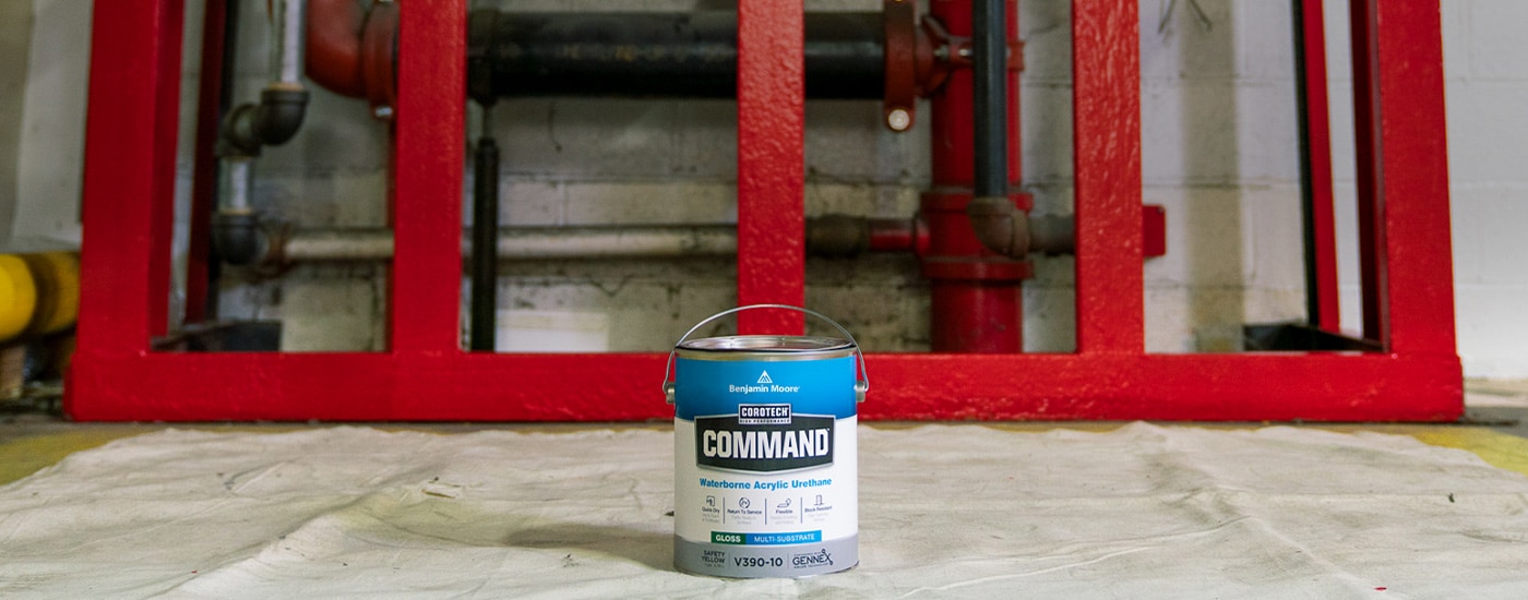 A gallon of Corotech® COMMAND® on a paint canvas in a warehouse.