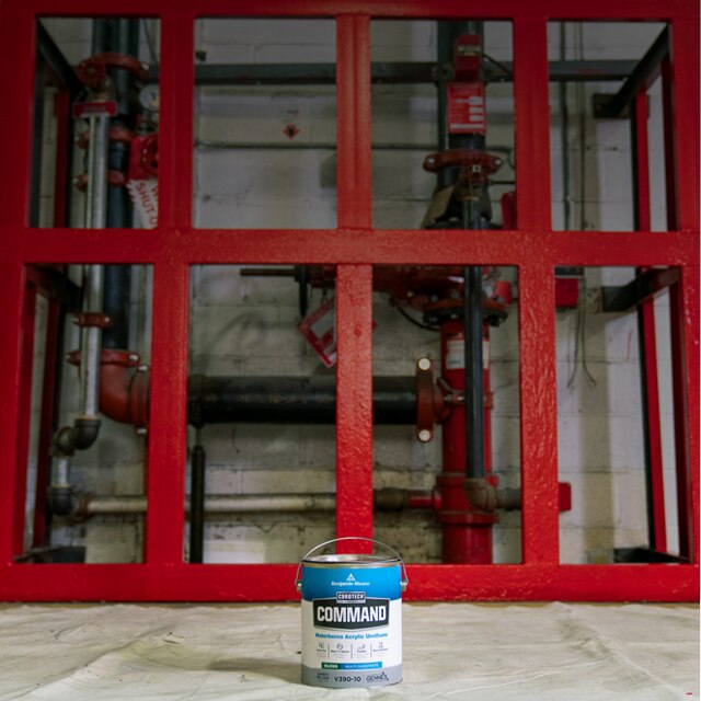 A gallon of Corotech® COMMAND® on a paint canvas in a warehouse.