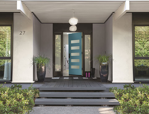 Turquoise blue door on a modern home. Turquoise blue door on a modern home.
