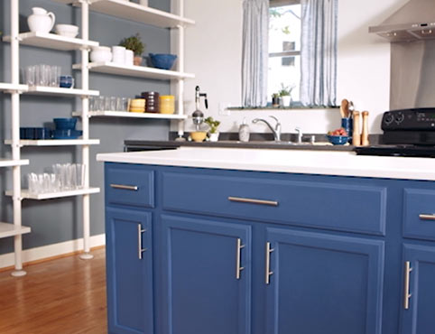 Cool blue kitchen color scheme with blue kitchen cabinets.