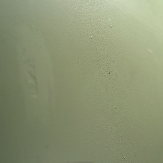 Green paint dripping down a wall. Green paint dripping down a wall.