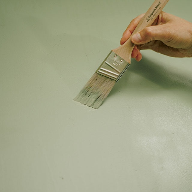 Painting green on an unevenly painted wall. Painting green on an unevenly painted wall.