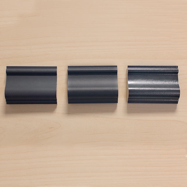 Black trim samples with different finishes.