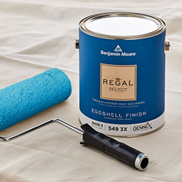 A can of Benjamin Moore Regal® Select paint in a newly painted room.